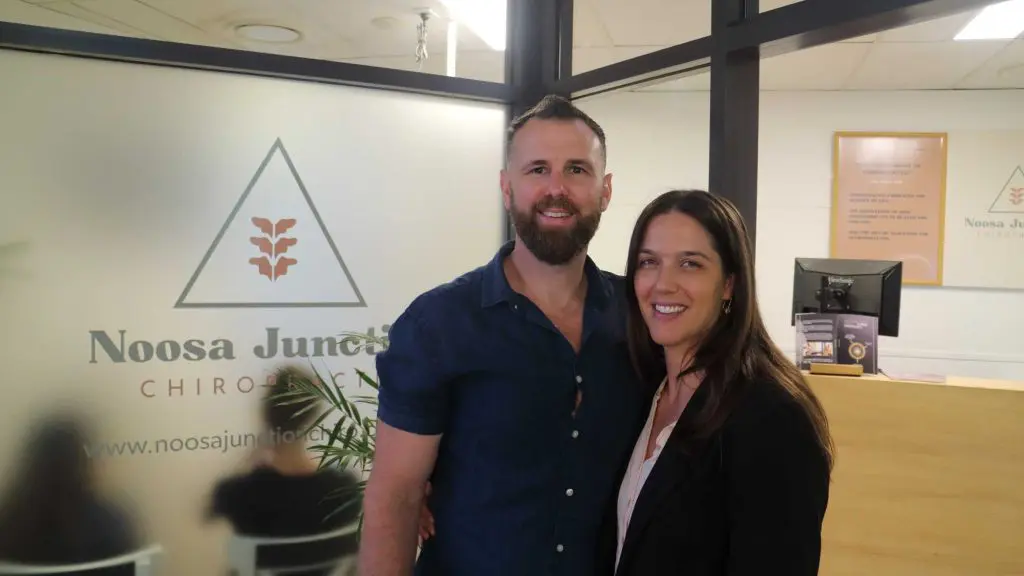 Dr Adam and Dr Jacqui smiling outside noosa junction chiro clinic
