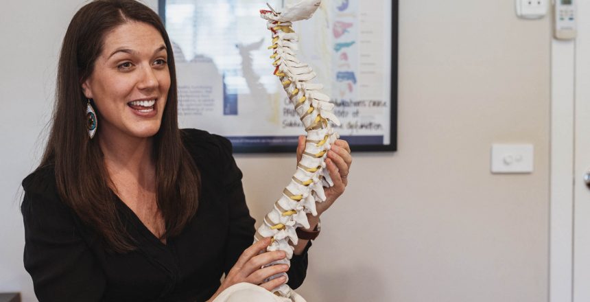 Lady holding a spine prop